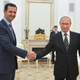 FILE - In this file photo taken on Tuesday, Oct. 20, 2015, Russian President Vladimir Putin, center, shakes hand with Syrian President Bashar Assad as Russian Foreign Minister Sergey Lavrov, right, looks on in the Kremlin in Moscow, Russia. When Russian Foreign Minister Sergey Lavrov said his country is ready to aid Syrian rebels fighting Islamic State militants on the ground, rebel commanders scoffed at the notion, pointing out that Russian aircraft were pounding rebel bases in central and northern Syria on daily basis.
